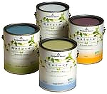 Group of Benjamin Moore paint cans stacked in front of a color sample card