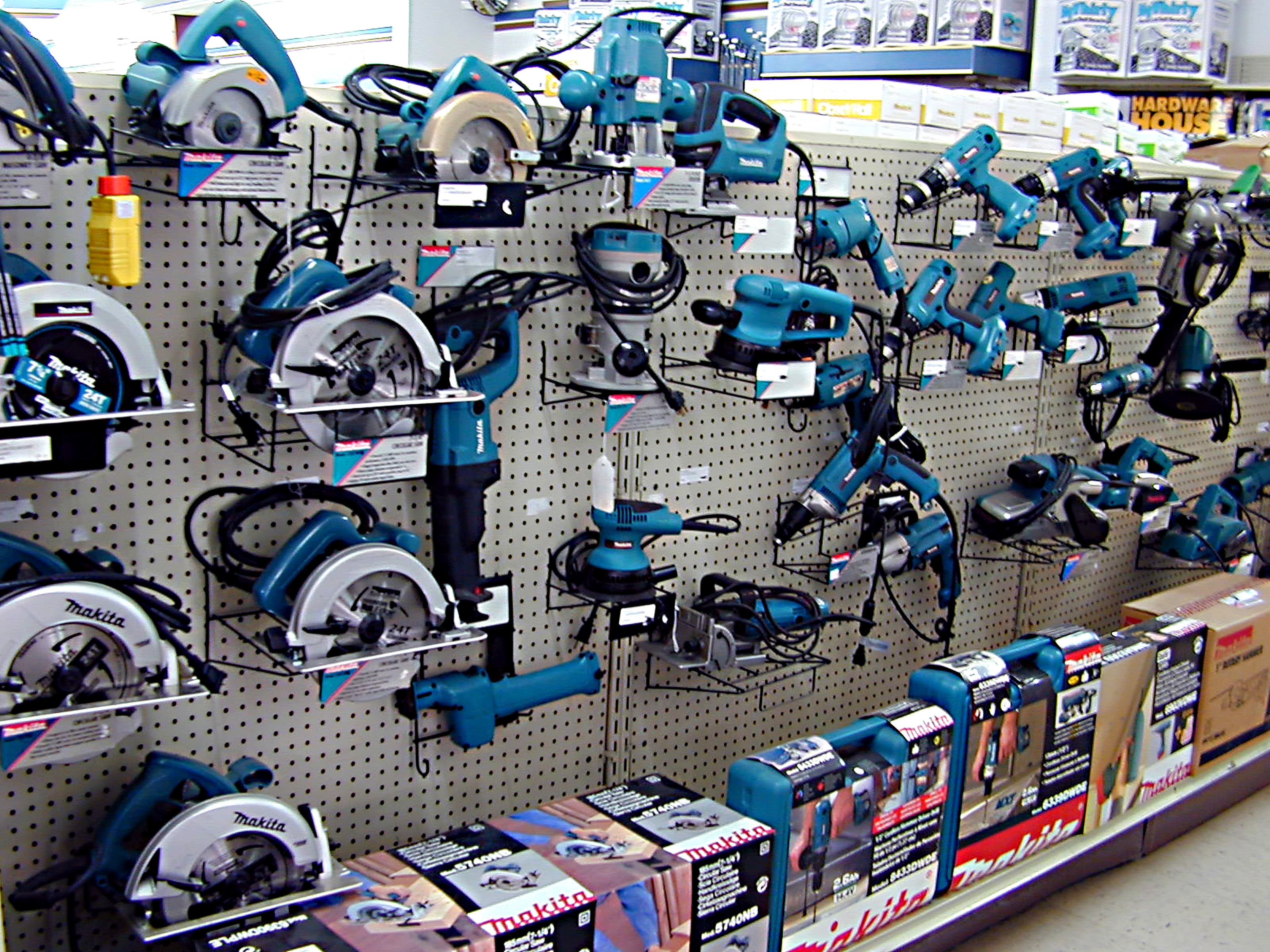 Full line of Makita power tools on the wall