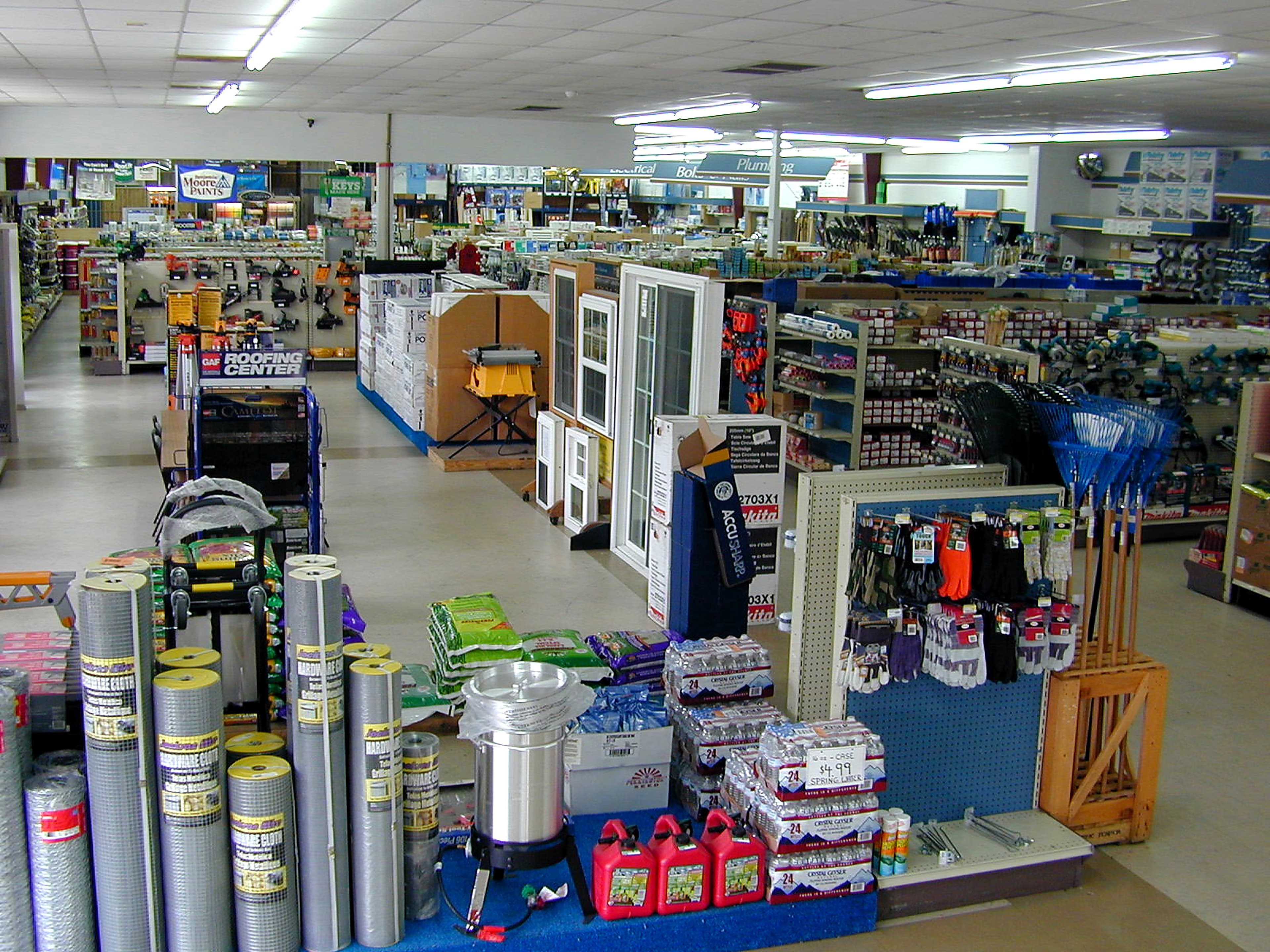 Interior of Coastal Hardware showing aisles, tool displays, and the roofing center